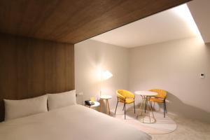 En eller flere senge i et værelse på Ren Mei Fashion Hotel