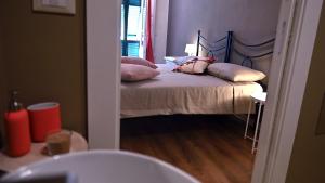 En eller flere senger på et rom på L'Iris B&B in Terrazza