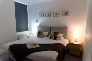 Llit o llits en una habitació de GreenStar Apartments