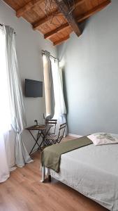 En eller flere senger på et rom på L'Iris B&B in Terrazza