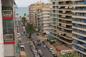 a view of a city street with cars and buildings at piso con estilo cerca de la playa in Cullera