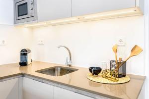 Kuchyňa alebo kuchynka v ubytovaní iloftmalaga Studio Apartments