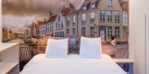 Voodi või voodid majutusasutuse Hotel Marcel toas