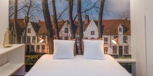 Voodi või voodid majutusasutuse Hotel Marcel toas