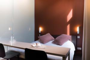 Voodi või voodid majutusasutuse Hotel Marcel toas