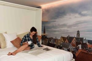 Voodi või voodid majutusasutuse Hotel Marcel toas