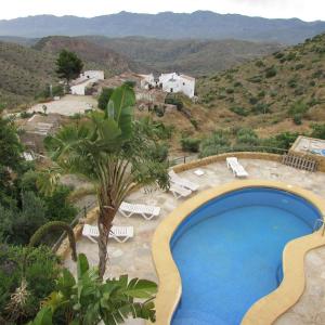 a swimming pool with a view of the mountains at ALBARICO RETREAT in Bédar