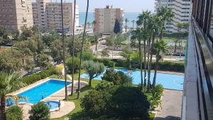 a view of two swimming pools in a city at Apartament Los Planetas in Alicante