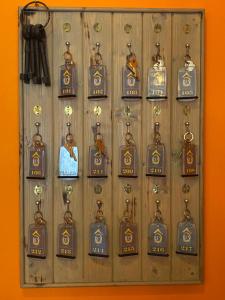a wall with lots of lockets on it at REV HÔTEL in Lamalou-les-Bains