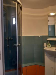a bathroom with a shower and a sink at Villa Sun & Sea in Constanţa