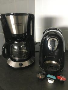 a coffee maker sitting on a counter next to a toaster at Fewo Nationalpark Schwarzwald in Freudenstadt