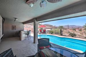 a view of a swimming pool from the patio of a house at Lake Havasu Home with Heated Pool, Spa and Mtn Views! in Lake Havasu City