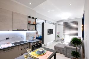A kitchen or kitchenette at Adell Deluxe Apartments