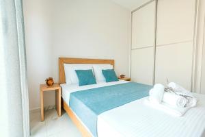 Posteľ alebo postele v izbe v ubytovaní Design Suites Efharis (Brusco)