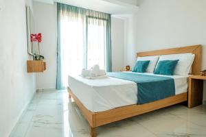 Posteľ alebo postele v izbe v ubytovaní Design Suites Efharis (Brusco)