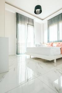 Posteľ alebo postele v izbe v ubytovaní Design Suites Efharis (Brusco)