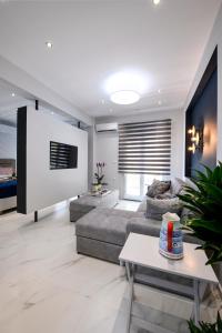 A television and/or entertainment centre at Adell Deluxe Apartments
