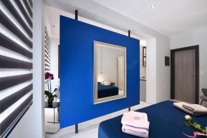 Postel nebo postele na pokoji v ubytování Adell Deluxe Apartments