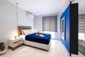 A bed or beds in a room at Adell Deluxe Apartments