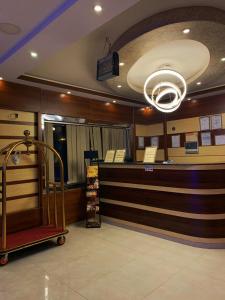a salon with a luggage cart in a room at Buyutat Najran Serviced Apartments بيوتات نجران للشقق المخدومة in Najran
