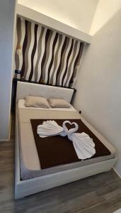 Postel nebo postele na pokoji v ubytování Apartmani Tatić Štinjan