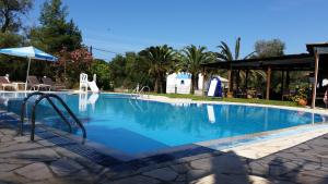 The swimming pool at or close to Pension Nychterida