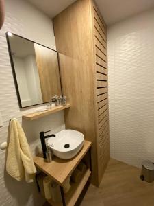 a bathroom with a sink and a mirror at Luxury Apartment Knezovic in Sinj +38 photos