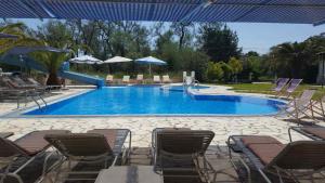 The swimming pool at or close to Pension Nychterida
