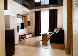 TV a/nebo společenská místnost v ubytování family hotel - City hotel yambol