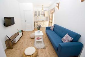 TV a/nebo společenská místnost v ubytování Apartmani Rustica