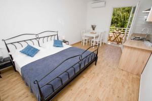 Postel nebo postele na pokoji v ubytování Apartmani Rustica