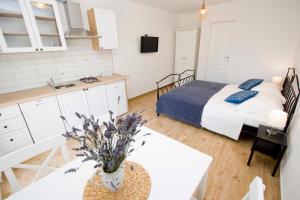 Postel nebo postele na pokoji v ubytování Apartmani Rustica