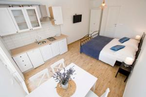 Postel nebo postele na pokoji v ubytování Apartmani Rustica