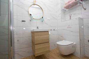 Koupelna v ubytování Apartmani Rustica + 37 fotografií