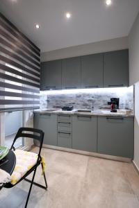 A kitchen or kitchenette at Adell Deluxe Apartments