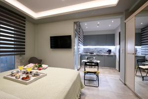 A television and/or entertainment centre at Adell Deluxe Apartments