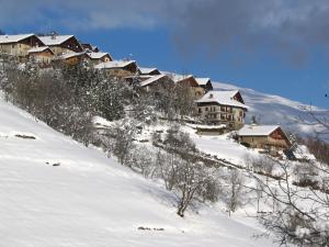a group of houses on a snow covered mountain at Maison de l'Epine -spa- Versant du soleil in Granier