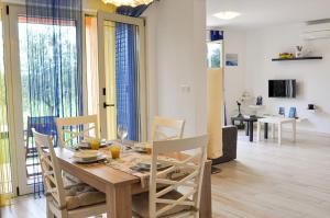 a dining room and living room with a table and chairs at Apartment Lavandula in Labin