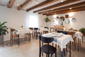Reštaurácia alebo iné gastronomické zariadenie v ubytovaní Agriturismo Basegò