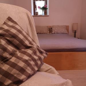 מיטה או מיטות בחדר ב-Antico Pozzo
