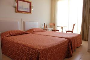 Postel nebo postele na pokoji v ubytování Hotel Vanilla