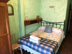 Säng eller sängar i ett rum på VUT La Villarina