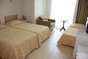 Postel nebo postele na pokoji v ubytování Hotel Vanilla