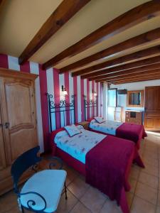 Cama o camas de una habitación en Casa de Labranza Ría de Castellanos