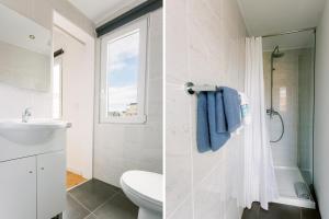 un bagno con un lavandino e una doccia di PortoVivo Bonjardim Apartamento a Porto Altre 52 foto