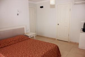 Postel nebo postele na pokoji v ubytování Hotel Vanilla