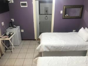 Un ou plusieurs lits dans un hébergement de l'établissement Ankuweni Guest house