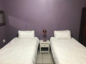 Un ou plusieurs lits dans un hébergement de l'établissement Ankuweni Guest house