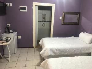 Un ou plusieurs lits dans un hébergement de l'établissement Ankuweni Guest house