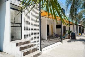 a building with a staircase next to a street at Casa Pia in Sayulita +33 photos